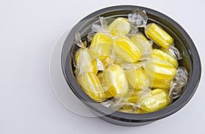 Sherbet sweets in a black bowl.