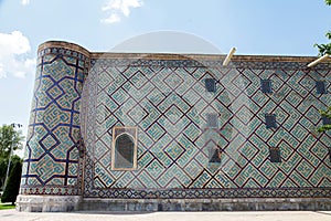 Sherdor Madrasah on Registan Square in Samarkand in Uzbekistan. Side mosaic wall. 29.04.2019