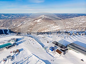 Sheregesh Kemerovo region ski resort in winter, landscape on mountain and hotels, aerial top view