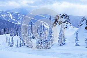 Sheregesh ski resort in Russia, located in Mountain Shoriya, Siberia. Winter landscape, trees in snow, clouds