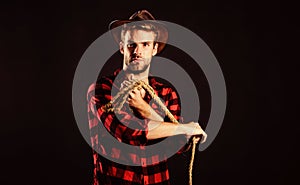 Sheriff. wild west rodeo. man in hat black background. western cowboy portrait. cowboy with lasso rope. Western. man