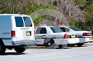 Sheriffs car and van - police car photo