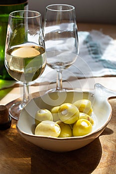 Sherry wine tasting, dry fino, manzanilla or palomino jerez fortified wine in glasses, Jerez de la Frontera, Andalusia, Spain photo