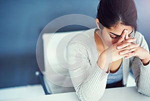 Shes close to her breaking point. a businesswoman looking stressed at her desk.