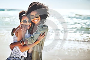 Shes the closest friend I have. two girlfriends enjoying themselves at the beach.