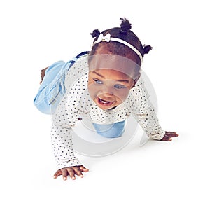 Shes a curious cutie. Studio shot of a baby girl crawling against a white background.