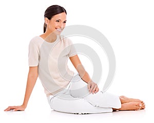 Shes everybodys woman. Studio shot of a casually dressed young woman isolated on white.