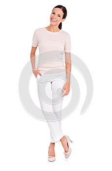 Shes everybodys woman. Studio shot of a casually dressed young woman isolated on white.