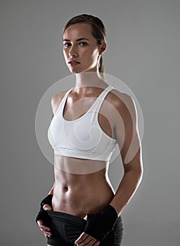 Shes got the confidence to keep going. an athletic woman ready for her kickboxing class.