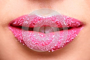 Shes got an insatiable sweet tooth. a womans lips covered in sugar granules.