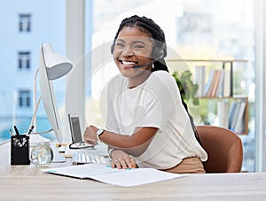 Shes got a real passion for customer service. a young female call center agent using a computer at work.