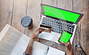 Shes got student loans to pay. High angle shot of an unrecognizable female student using a laptop and credit card while