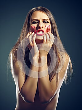 Shes at her wits end. Portrait of an attractive young woman raging in the studio.