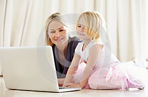 Shes pretty techno-savvy for such a young kid. Shot of a mother and daughter bonding while surfing the internet together