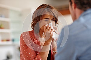 Shes reached her breaking point. a woman crying in front of her husband.