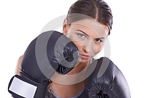 Shes ready for a fight. Portrait of an attractive young female boxer.
