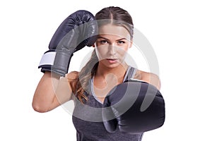 Shes ready for a fight. Portrait of an attractive young female boxer.