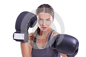 Shes ready for a fight. Portrait of an attractive young female boxer.