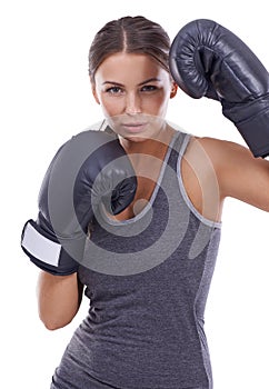 Shes ready for a fight. Portrait of an attractive young female boxer.