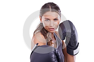 Shes ready for a fight. Portrait of an attractive young female boxer.