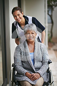 Shes always there when I need someone to care. Portrait of a senior woman in a wheelchair being for for by a nurse at a
