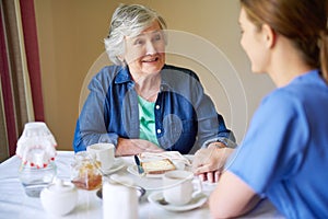 Shes always up for a chat. a resident and a nurse at a retirement home.