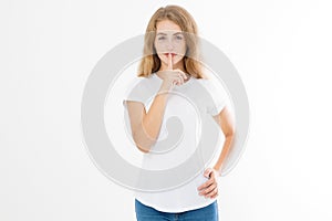 Shhh sign. Young woman showing shh gesture to keep a silent. Girl in template white t shirt keep a secret. Quiet place and silence