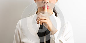 Shhhhh! Businesswoman requiriong silence