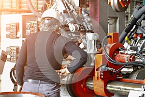 Shief engineer setting up the machine steel cutting machine, steel bar, bending