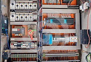 Shield, control of industrial equipment. Wires, connections, switches. Electrical control panel