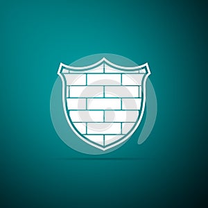 Shield with cyber security brick wall icon isolated on green background. Data protection symbol. Firewall logo. Network