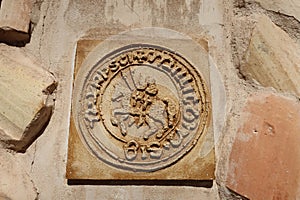 Shield on the facade of the house of the Templar Squad of Villena, Alicante, Spain