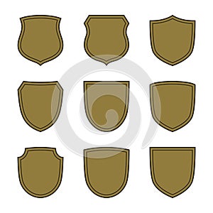 Shield shape bronze icons set. Simple silhouette flat logo on white background. Symbol of security, protection, safety