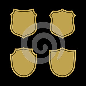 Shield shape gold icons set. Simple flat logo on black background. Symbol of security, protection, safety, strong