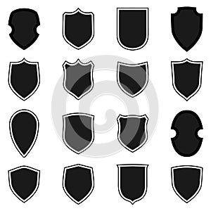 Shield shape icons set. Black label signs isolated on white background. Symbol of protection, arms, security, safety