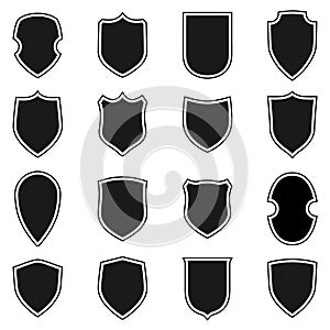 Shield shape icons set. Black label signs isolated on white background. Symbol of protection, arms, security, safety