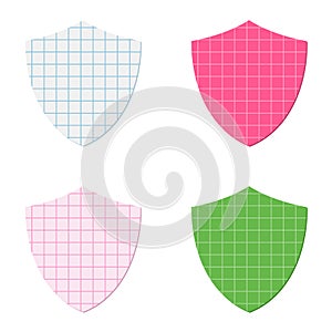 Shield shapes cut out of squared graph paper