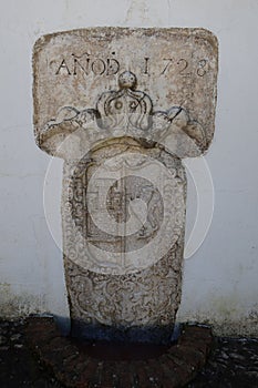 Shield of the year 1728 in a fountain with spring water in Castano del Robledo, magical town of Andalusia. Huelva, Spain