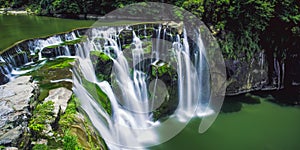 Shifen Waterfall Long Exposure photography on Sunny Day in Pingxi District, New Taipei, Taiwan. photo