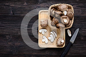 Shiitake mushrooms on the wooden background