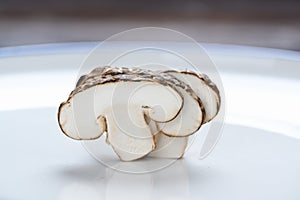 Shiitake mushrooms on the wooden background