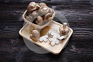 Shiitake mushrooms on the wooden background