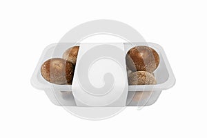 shiitake organic mushrooms for sale in a plastic tray on a light background. lentinula edible, Japanese forest mushroom