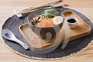 Shiitake and soba soup with carrot, spinach, quail egg, and soy sauce