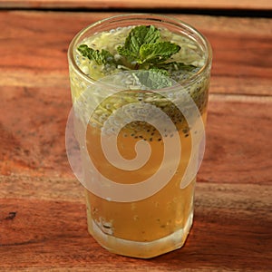 Shikanji or Lemon Sharbat is most favourite cool drinks of India, served in a glass over a rustic wooden background,a refreshing photo