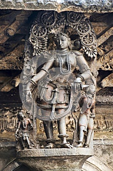 Shilabalika, celestial maiden, as a Gypsy girl. Chennakeshava temple, Belur, Karnataka. Notice the hairstyle.