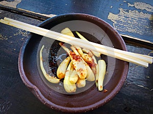 Shima rakyo, island scallions with soy sauce and katsuo bushi