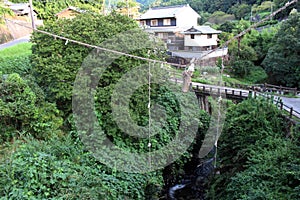 Shimenawa rope hanging in the middle of bridge in Asuka, Nara