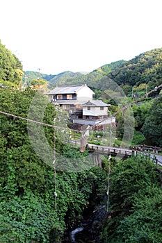 Shimenawa rope hanging in the middle of bridge in Asuka, Nara