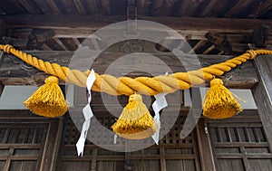 Shimenawa rope and zigzag paper decorations (in Japanese: shide) at shinto shrine, Kanagawa, Japan